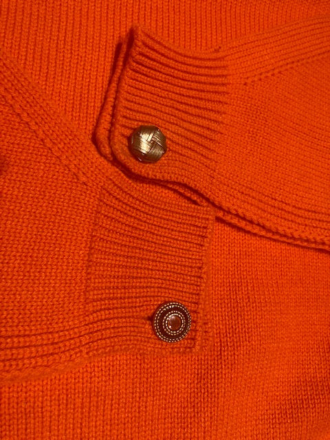 Orange turtleneck sweater with Isabella jewel buttons