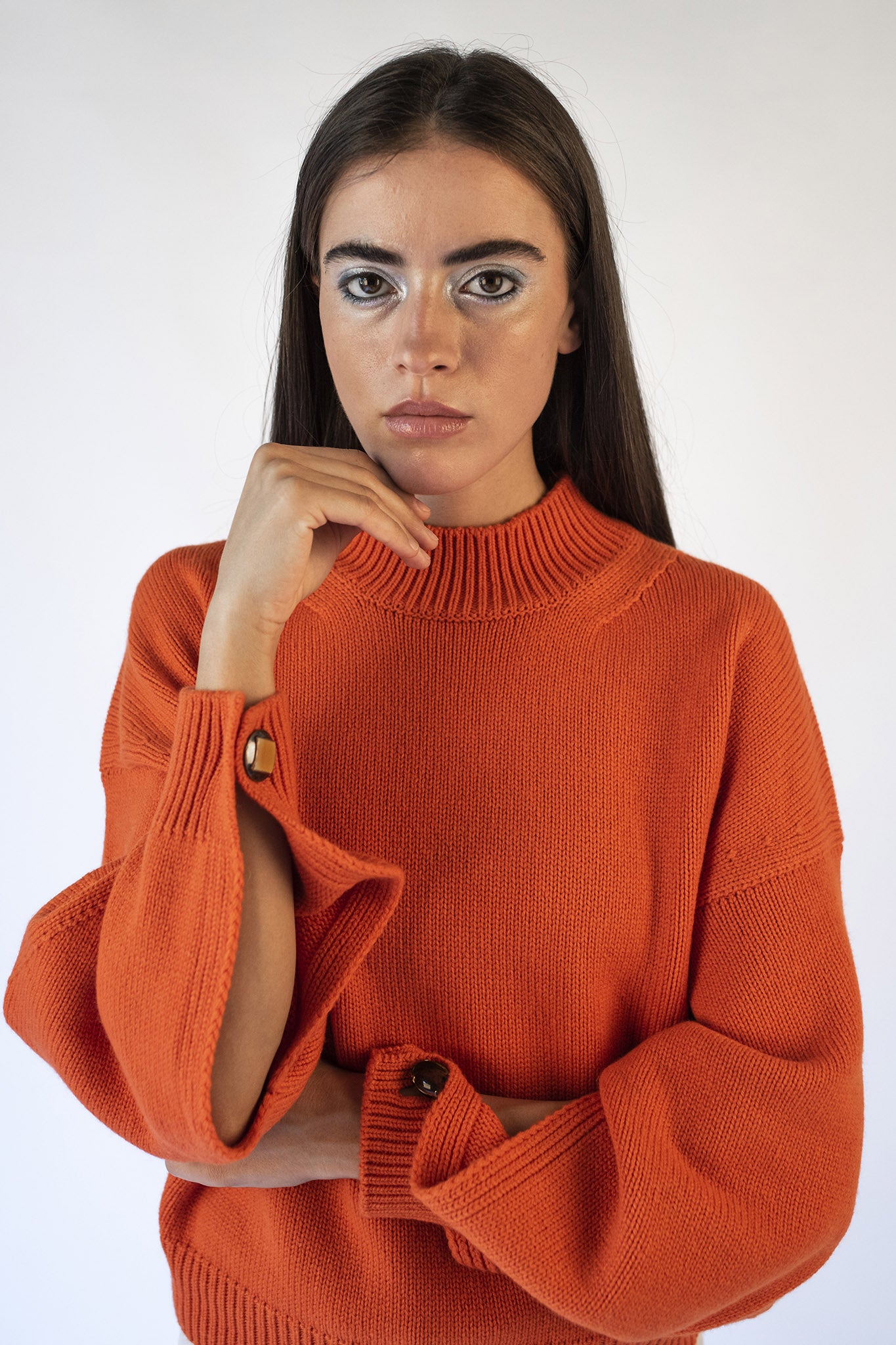 Orange turtleneck sweater with Isabella jewel buttons